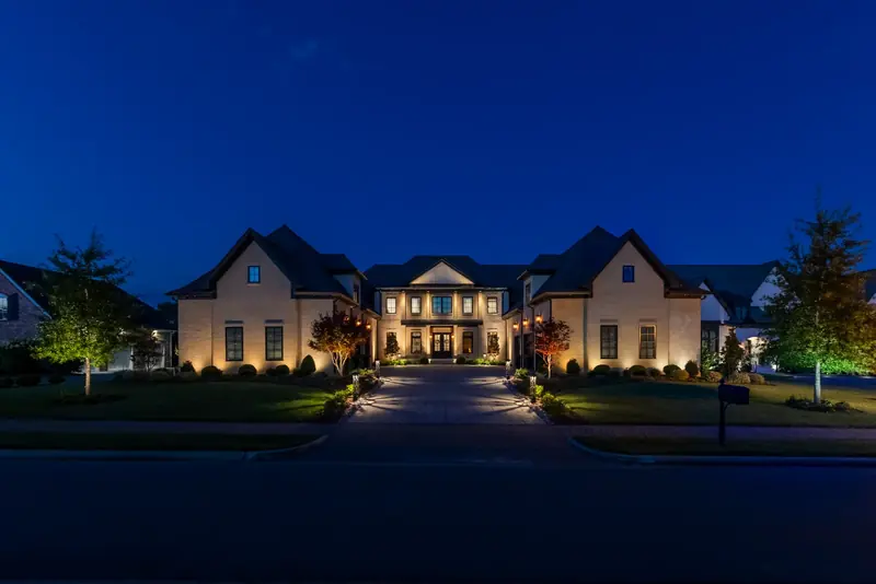 The same luxury home after professional landscape lighting design and installation by Light TN